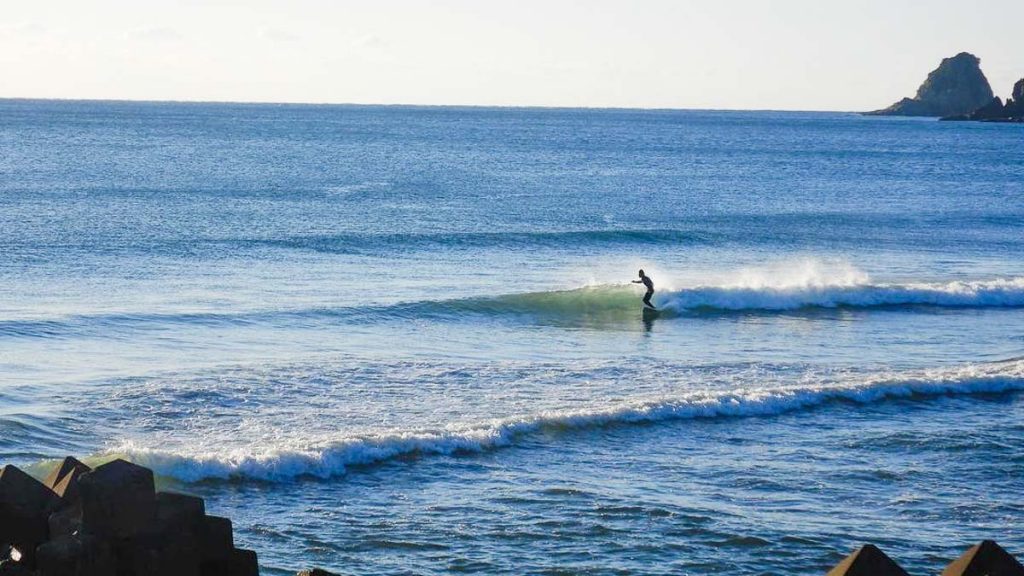 Man Surfing at Miyazaki Beach - Japan Outdoor Adventures