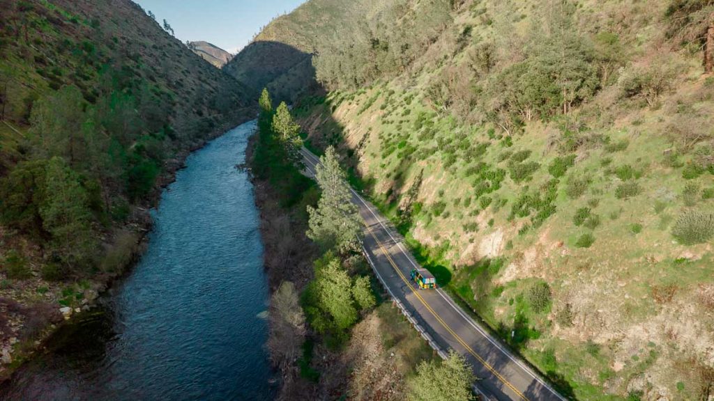 Campervan driving through a valley to Yosemite - San Francisco Itinerary