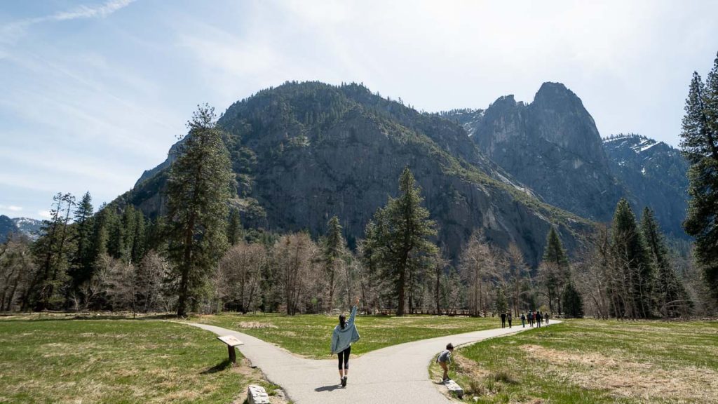 Girl standing at crossroads at Cook's Meadow Loop Yosemite - San Francisco Itinerary