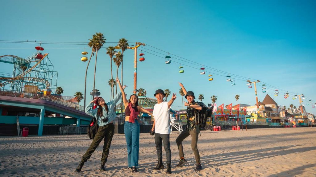 Friends on Santa Cruz beach by the boardwalk - Things to do in California