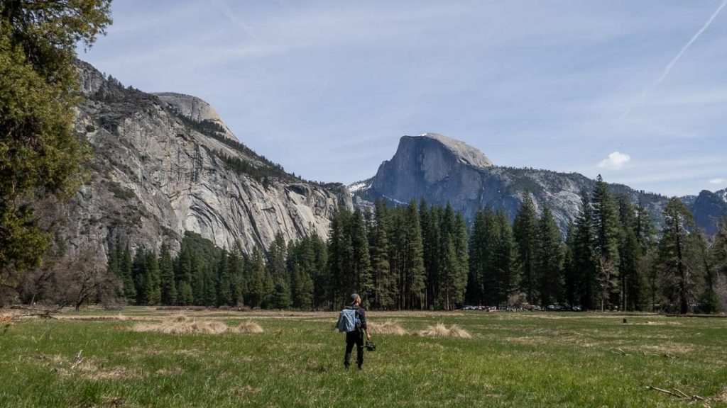 Man staring at Granite Cliffs at Cook's Meadow Loop Yosemite - San Francisco Itinerary