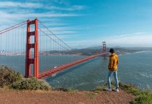 9 World Cup Host Cities Worth Adding to Your 2026 Travel Bucket List Guy standing by Battery Spencer Golden Gate Bridge - Day Trips from San Francisco