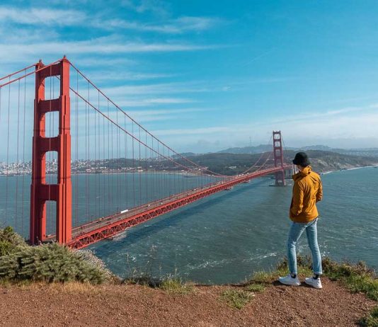 9 World Cup Host Cities Worth Adding to Your 2026 Travel Bucket List Guy standing by Battery Spencer Golden Gate Bridge - Day Trips from San Francisco