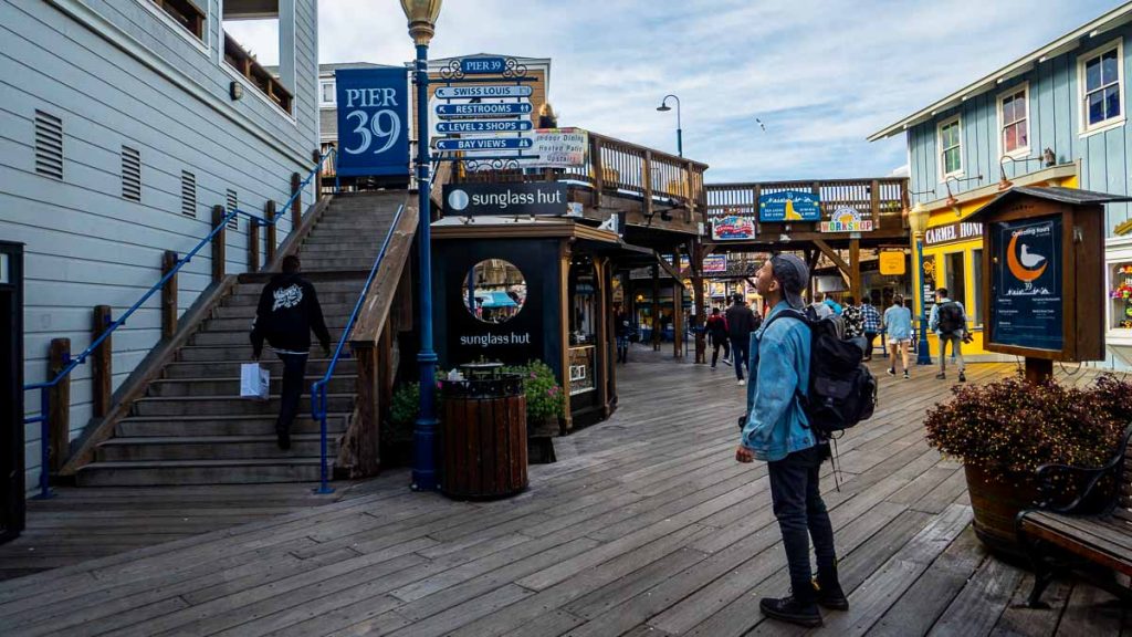 Man staring at Pier 39 sign - San Francisco Itinerary