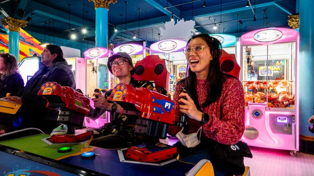 Friends playing arcade at Santa Cruz Boardwalk - SF Itinerary