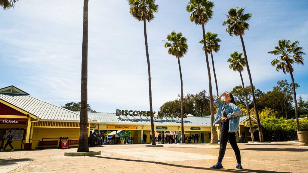 Lady standing at Six Flags Discovery Kingdom Entrance - Things to do in San Francisco