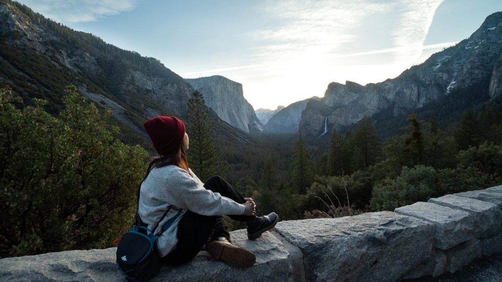 Girl watching sunrise at Tunnel Viewpoint Yosemite - SF itinerary