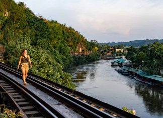 Central Thailand Guide for Explorers — 11 Things to Do in Nakhon Pathom, Ratchaburi, Kanchanaburi Kanchanaburi Death Railway Visitor Walking Along Tham Kra Sae Bridge - Thailand Road Trip