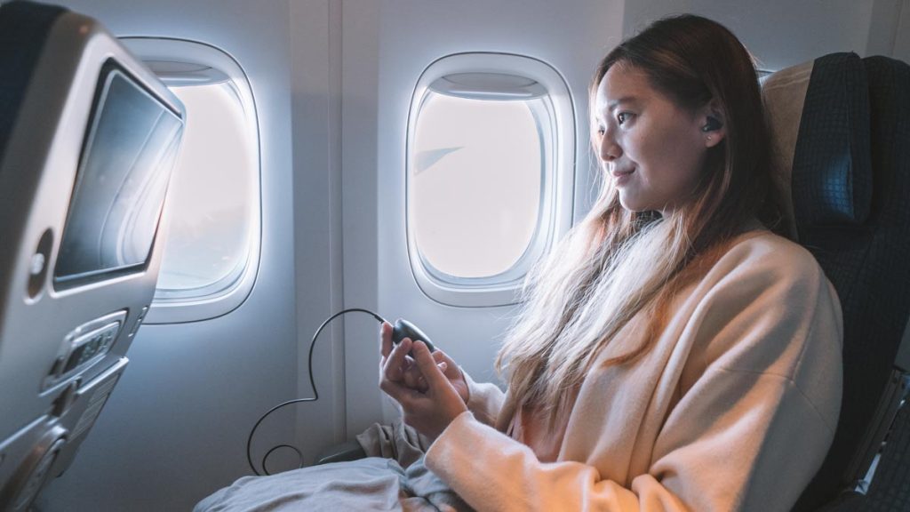 Girl Holding to LG Ear Buds on Flight - K-drama Filming Locations