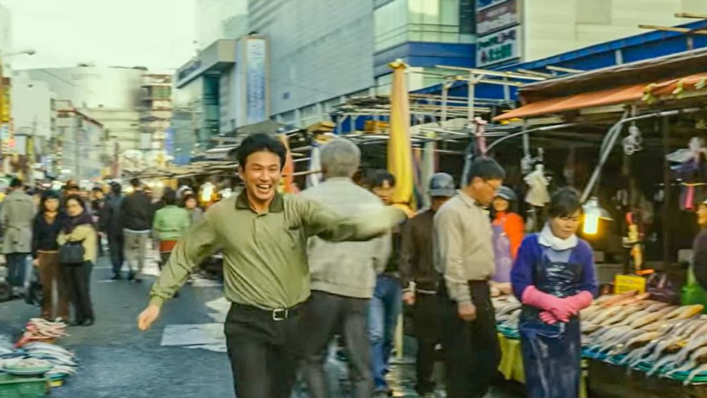 Man Running Through Market - Busan Guide