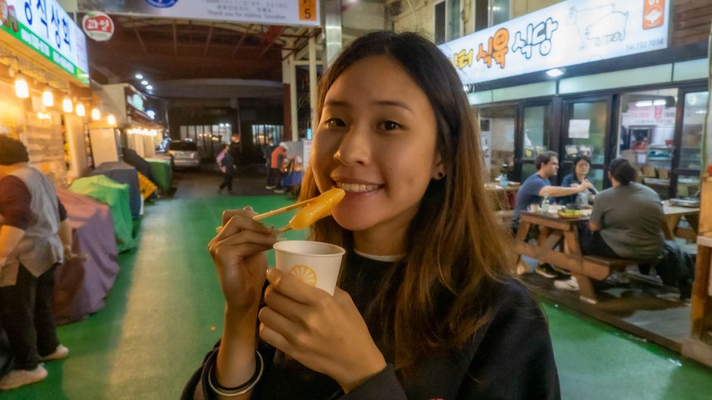Girl eating at Seogwipo - Things to do in Korea