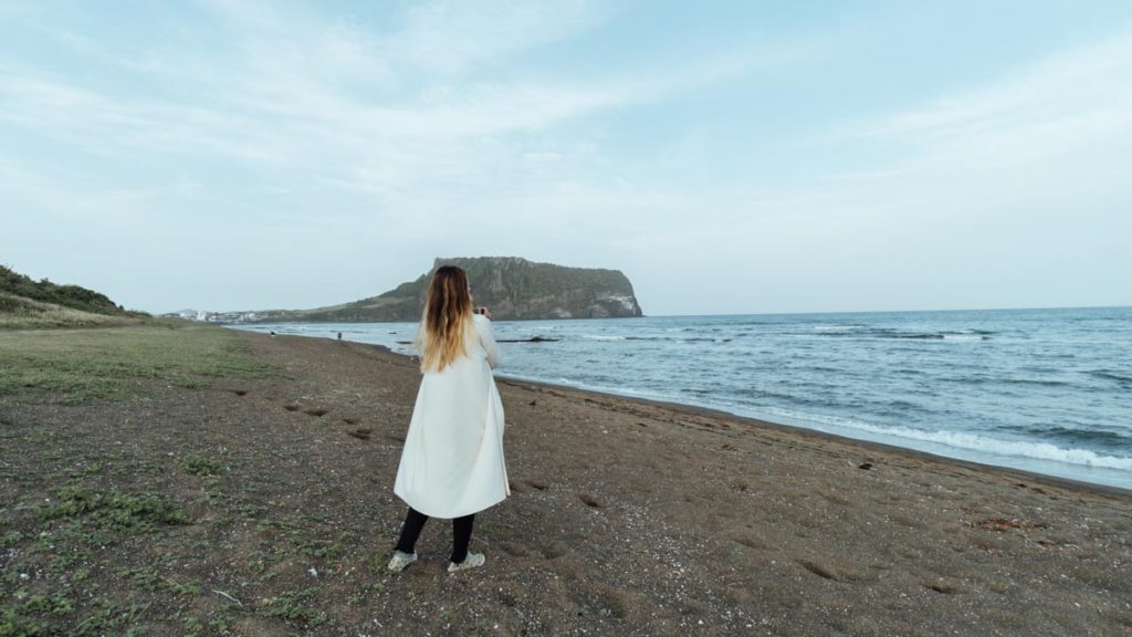 Girl taking picture of Seongsan Ilchulbong - K-pop Filming Locations