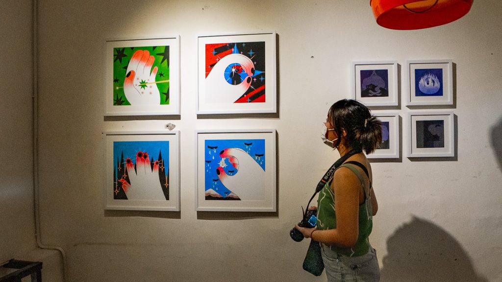 Girl admiring artwork at 11+ JB - Things to do in JB
