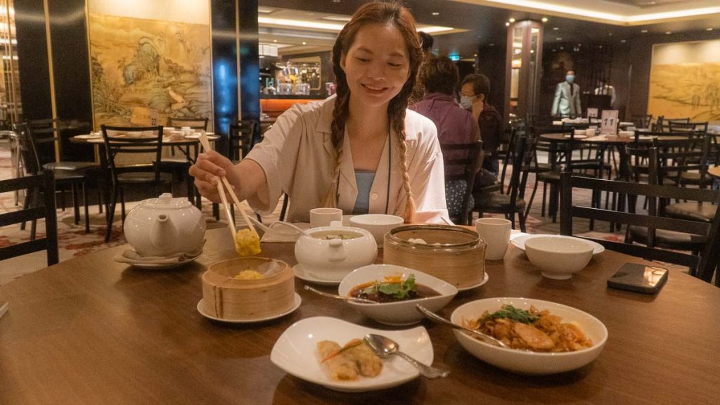 Girl Eating Dim Sum - Singapore Cruise