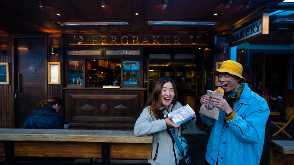 Friends eating Fergbaker - New Zealand Queenstown