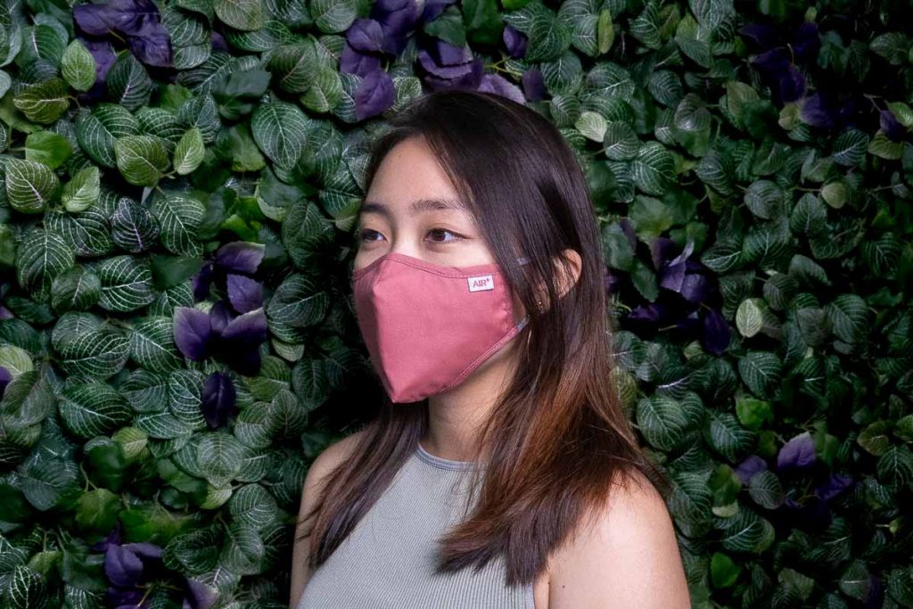 Girl wears Air+ Masks - Post-covid travel essentials