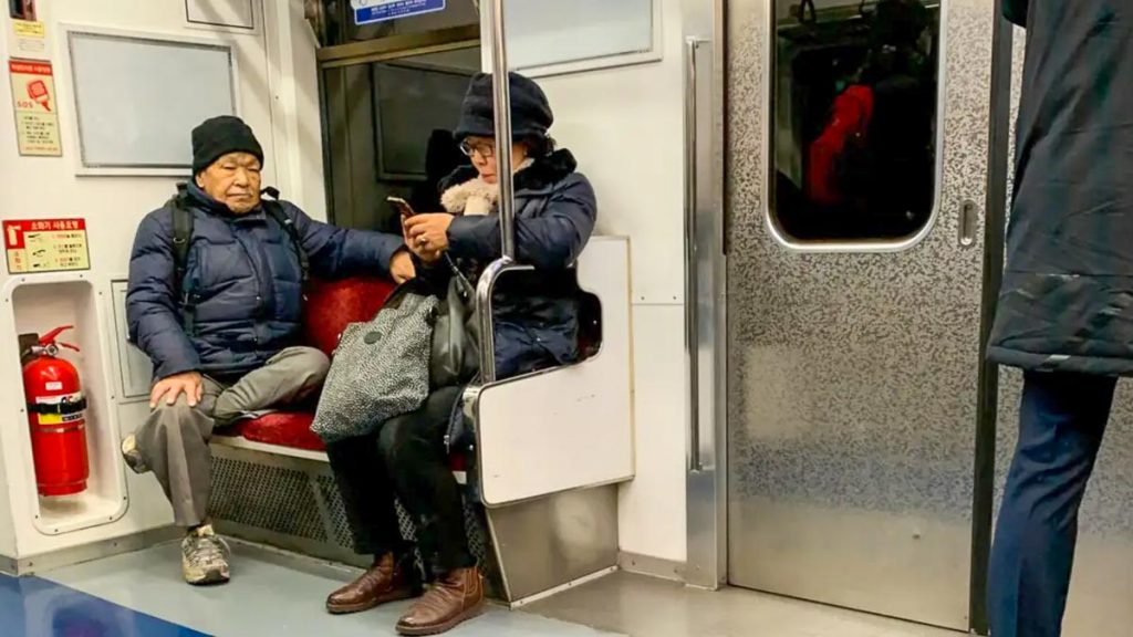 Elderly on Train Seat - Korean Society