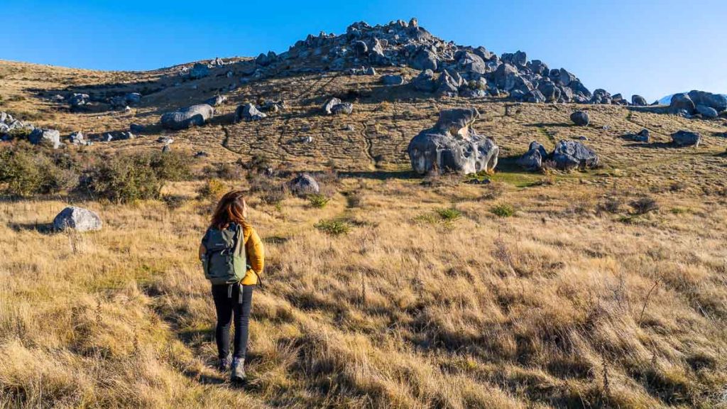 Girl at Castle Hill Kura Tawhiti - New Zealand South Island Itinerary