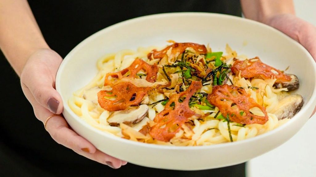 Person Serving Miso Alfredo Udon - Things to do in Johor Bahru