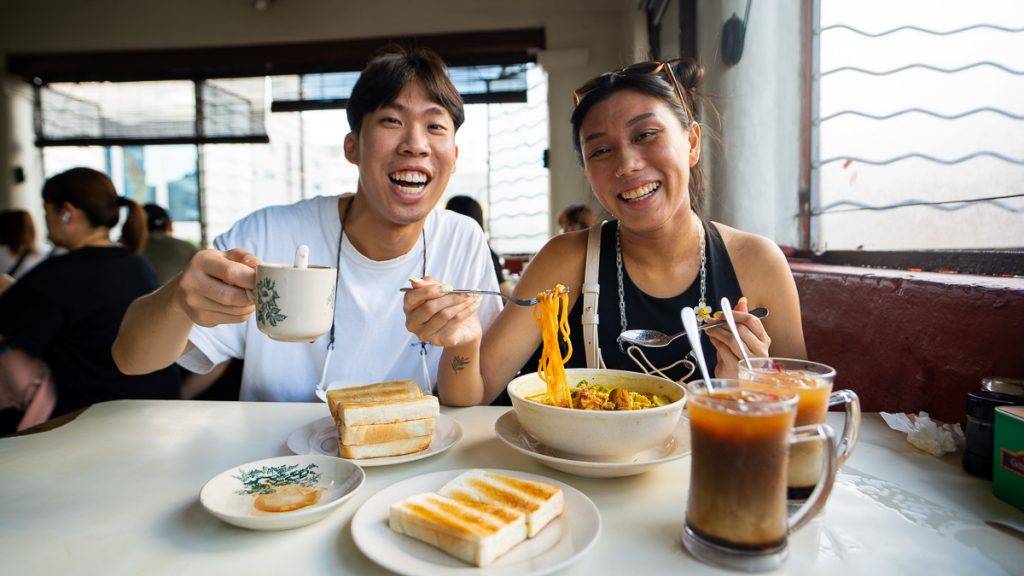 Friends having breakfast at Restoran Hua Mui - Things to do in JB