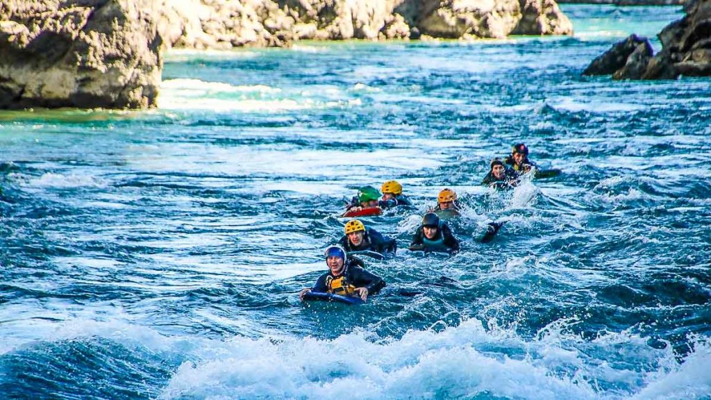 People riverboarding in Kawarau River - Things to do in Queenstown New Zealand