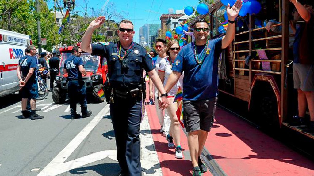 Two men holding hands at San Francisco Pride - Castro District