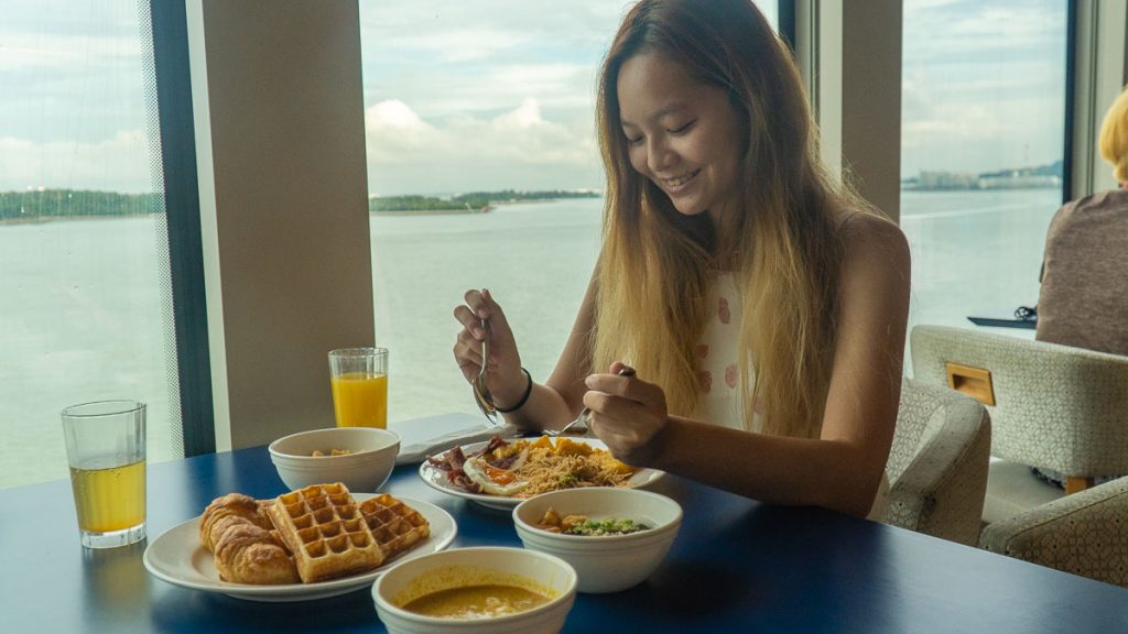 Girl Eating Breakfast Buffet - Singapore Cruise