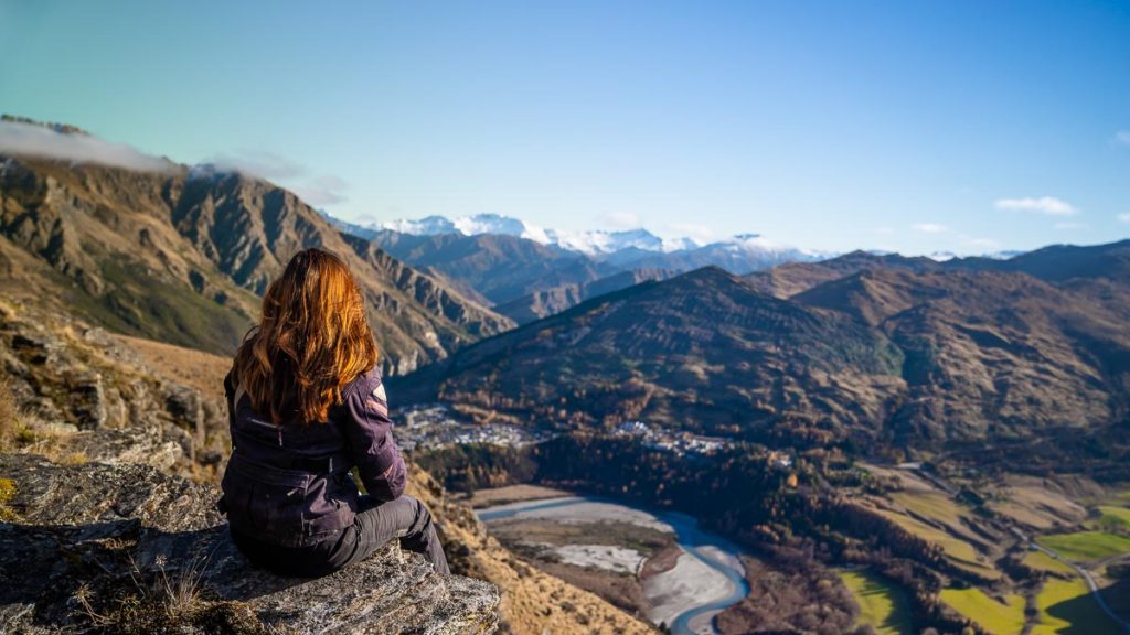 Girl overlooking scenery - New Zealand Off-Peak