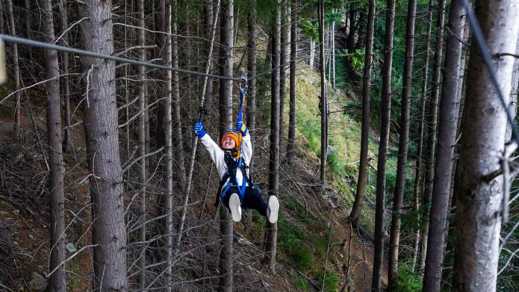 Girl Ziplining in Queenstown - New Zealand South Island