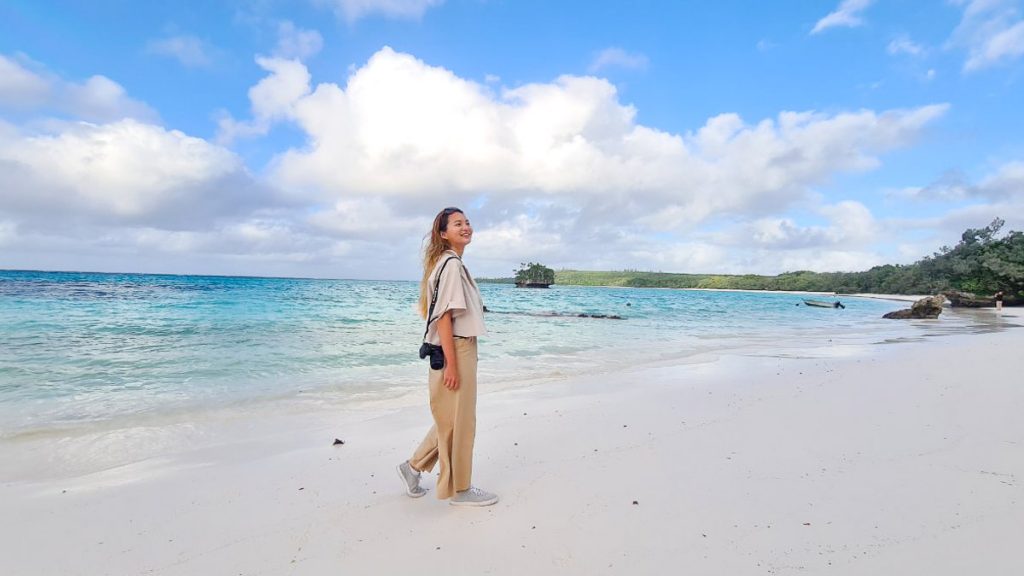 Girl on Beach at Luengoni Bay - Loyalty Islands