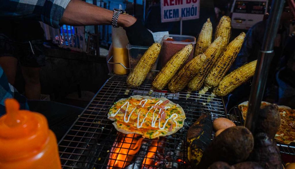 Vietnamese Pizza grilled on fire at Da Lat Night Market - Things to do in Southern Vietnam