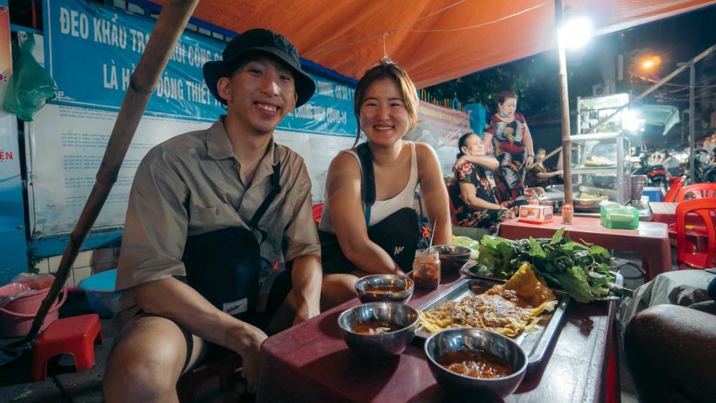 People Eating Egg Omelette at 200 Market - Things to do in Ho Chi Minh