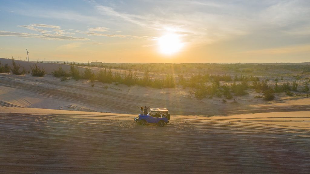 People Watching Sunrise at White Sand Dunes - Southern Vietnam Itinerary