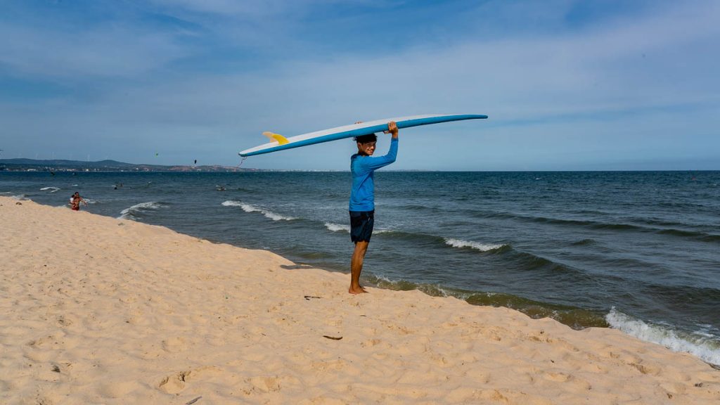 Surfer at Mui Ne Beach -  Best Things to do in Mui Ne