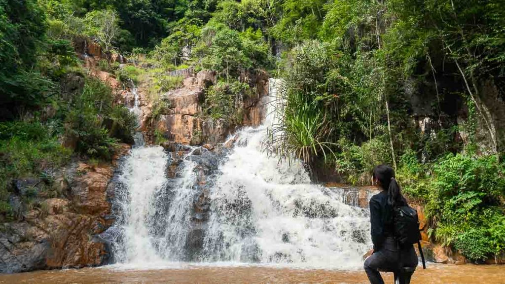 Girl Sitting on Chair and Looking at Datanla Waterfall - Things to do in Southern Vietnam