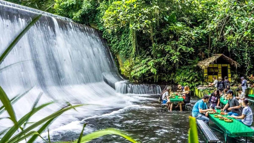 People Dining at Labassin Waterfall Restaurant - Family Vacation 2022