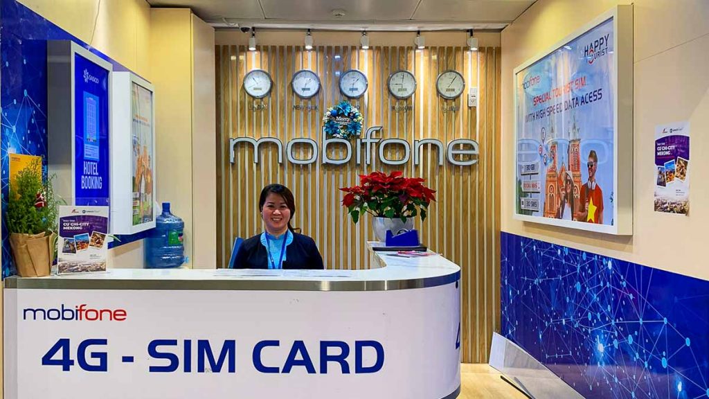 A lady at the desk of a SIM Card shop in Ho Chi Minh Airport - Vietnam guide