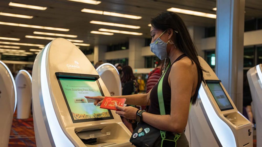 Girl checking into her flight at Changi Airport - Da Lat Itinerary