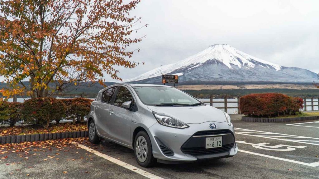 Car parked in front of Mt Fuji - Getting around in Japan