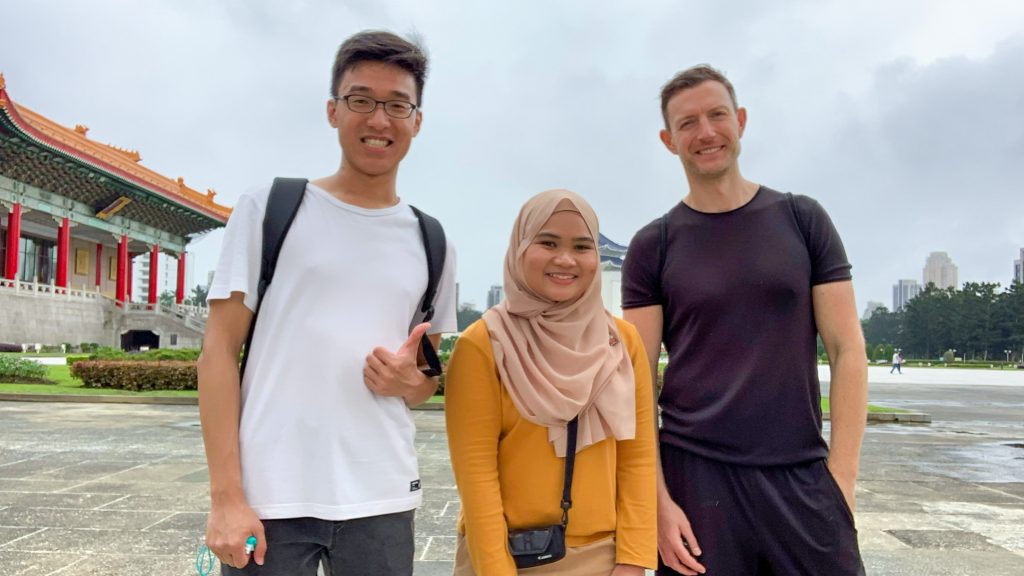 3 people smiling in front of Chiang Kai-shek Memorial Hall - Taipei Itinerary