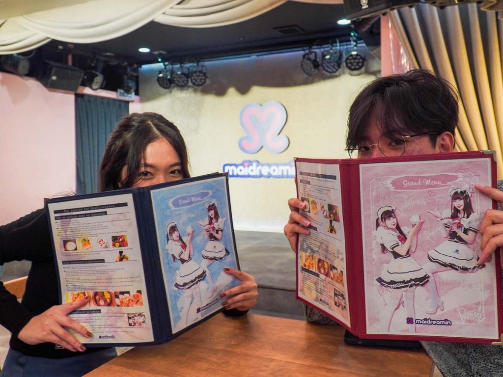 Friends at Maid Cafe in front of stage - Japan Itinerary