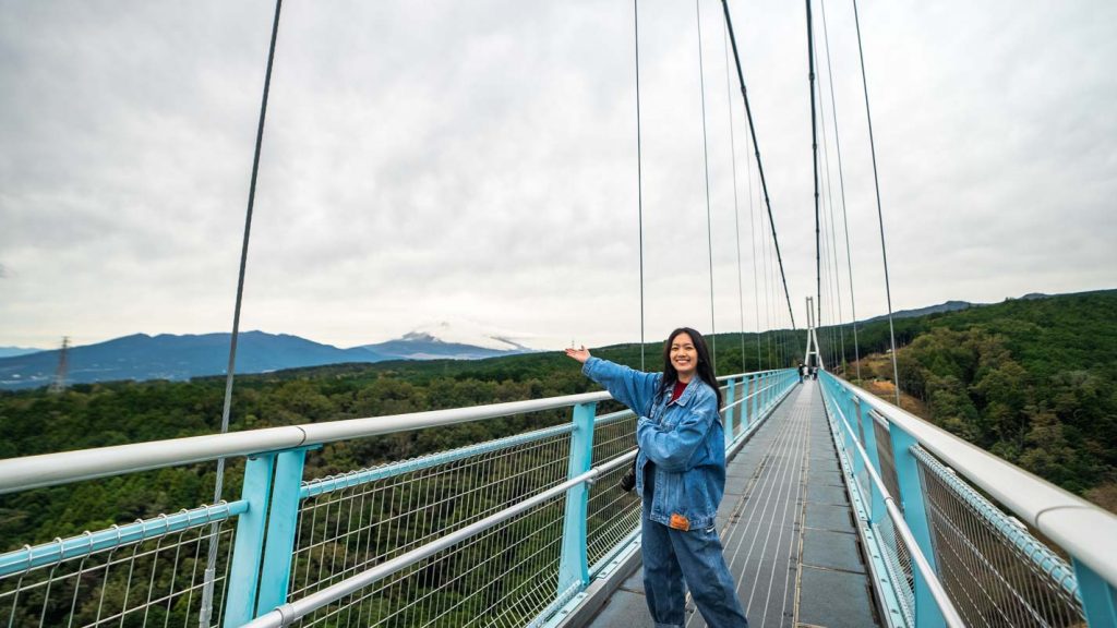 Girl standing on suspension bridge - Mt Fuji Viewing Spots