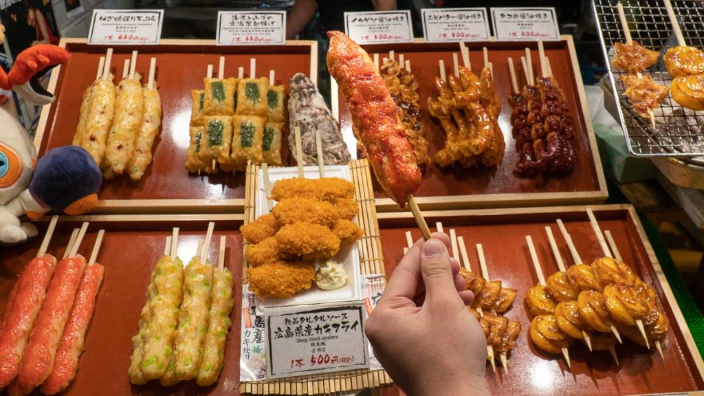 Hand Holding Crab Stick - Things to eat in Kyoto
