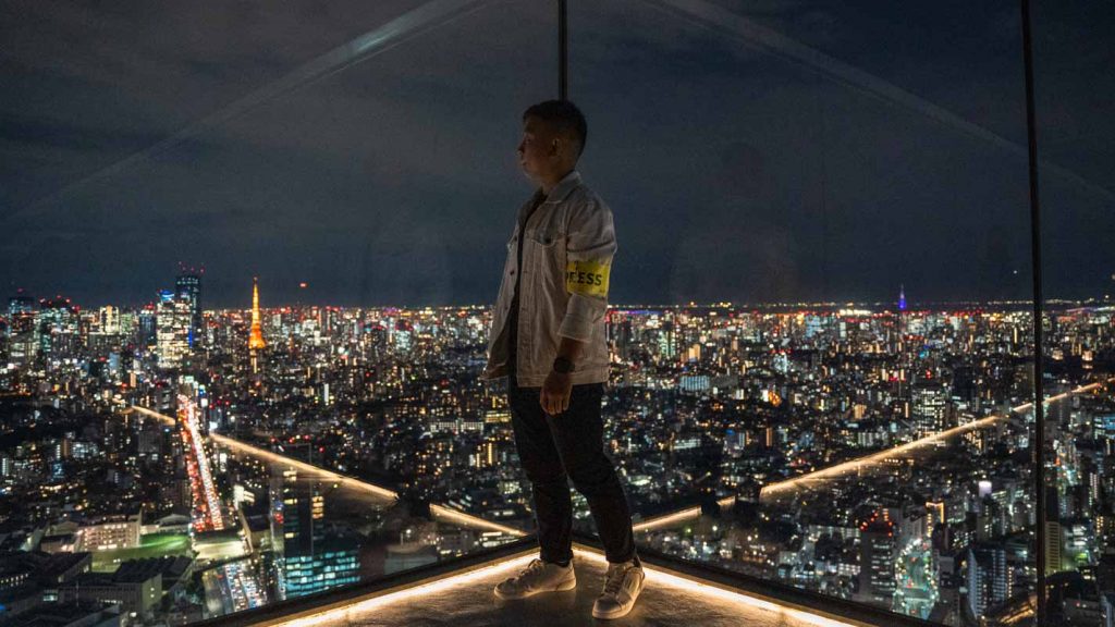 Man looking at Tokyo View at Shibuya Sky deck - Things to do in Japan