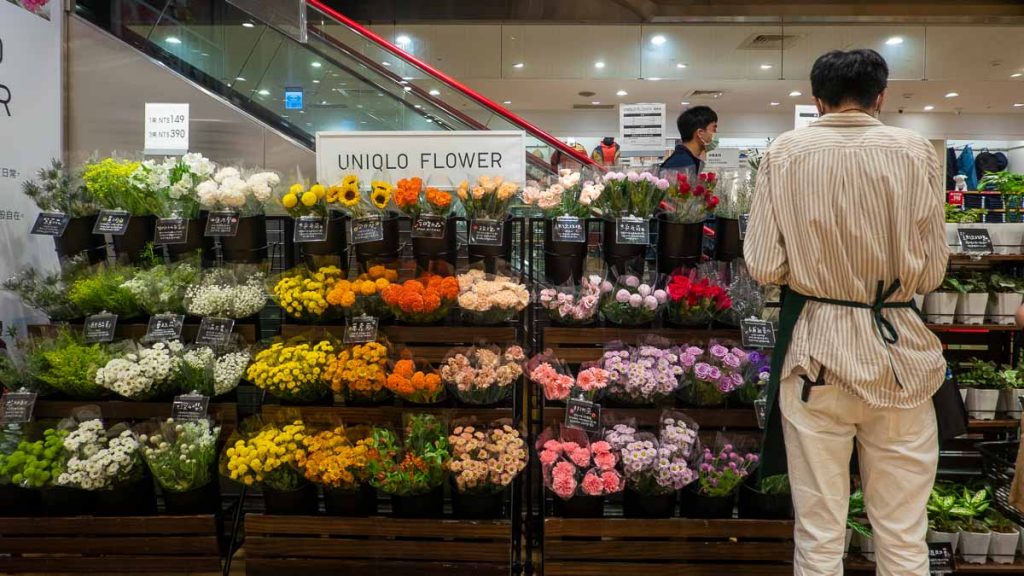 Man arranging flowers in uniqlo ximen - taipei itinerary