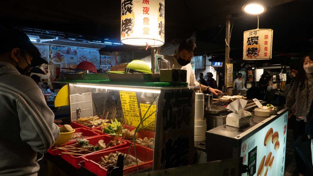 king oyster mushroom vendor in raohe night market - taipei itinerary