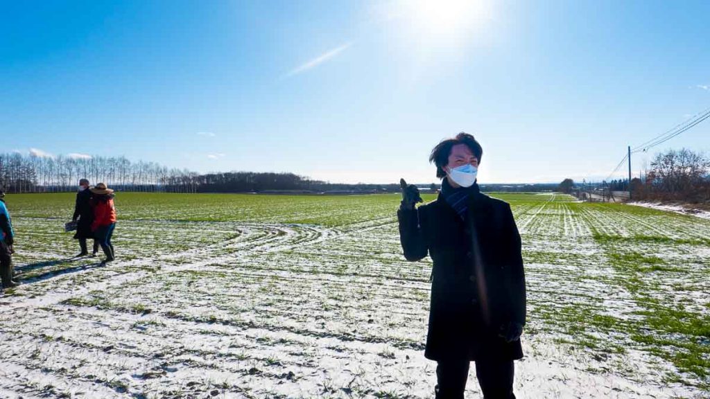 Man standing in field - Hokkaido