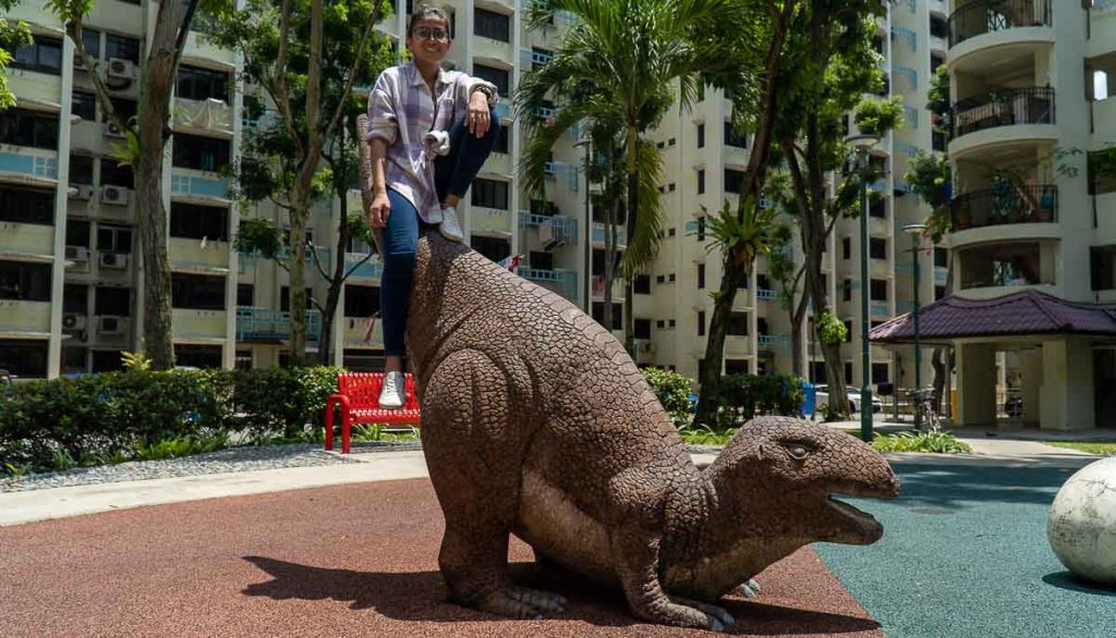 Girl on Baby Dinosaur at Dinosaur Playground - Things to do in Singapore