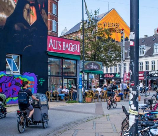 people cycling through norrebrogade - denmark norrebro