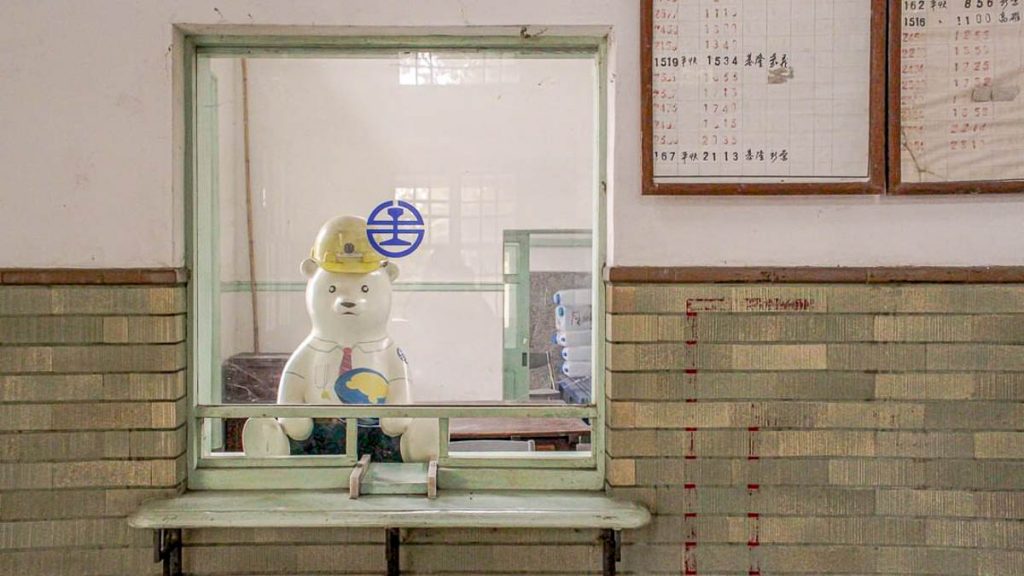 bear mascot at old tai'an railway station cultural park - things to do in taiwan